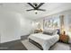 Bright bedroom with white walls, modern furnishings, and view of the street at 6845 E Osborn Rd # D, Scottsdale, AZ 85251