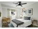 Bright bedroom featuring modern decor, a ceiling fan, and a window with natural light at 6845 E Osborn Rd # D, Scottsdale, AZ 85251