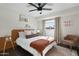 Cozy bedroom with unique décor, modern bed, and accents of orange and beige at 6845 E Osborn Rd # D, Scottsdale, AZ 85251
