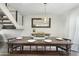 Formal dining room with elegant table setting and contemporary light fixture at 6845 E Osborn Rd # D, Scottsdale, AZ 85251