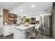 Bright kitchen with an island, stainless steel appliances, modern cabinets, and stylish seating at 6845 E Osborn Rd # D, Scottsdale, AZ 85251