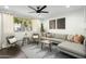 Stylish living room with a comfortable sofa, accent chairs, modern decor, and plenty of natural light at 6845 E Osborn Rd # D, Scottsdale, AZ 85251