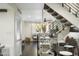Inviting living area with natural light, open staircase, and sleek décor at 6845 E Osborn Rd # D, Scottsdale, AZ 85251