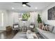Cozy living room featuring a comfortable sofa, stylish decor, and large windows for natural light at 6845 E Osborn Rd # D, Scottsdale, AZ 85251