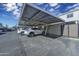 Covered parking area with multiple vehicles, offering convenient and protected parking spaces at 6845 E Osborn Rd # D, Scottsdale, AZ 85251