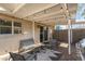 Inviting outdoor patio with comfortable seating, a grill, and string lights for ambiance at 6845 E Osborn Rd # D, Scottsdale, AZ 85251