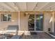 Charming outdoor patio with comfortable seating, string lights, and a view into the dining room at 6845 E Osborn Rd # D, Scottsdale, AZ 85251