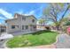 Spacious backyard with a well-maintained lawn and covered patio, perfect for outdoor entertaining at 7420 W Los Gatos Dr, Glendale, AZ 85310
