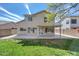 Spacious backyard featuring a covered patio and lush lawn, perfect for outdoor entertaining at 7420 W Los Gatos Dr, Glendale, AZ 85310