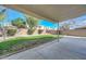 Lush backyard featuring a large manicured lawn, appealing landscaping, and ample space for outdoor activities at 7420 W Los Gatos Dr, Glendale, AZ 85310