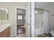 Bright bathroom showcasing a tub-shower combo with neutral tile flooring and a vanity at 7420 W Los Gatos Dr, Glendale, AZ 85310