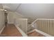 Hallway featuring hardwood floors and views to another floor via stairs at 7420 W Los Gatos Dr, Glendale, AZ 85310