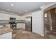 Kitchen features stainless steel appliances, white cabinets, and granite countertops at 7420 W Los Gatos Dr, Glendale, AZ 85310