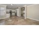 Kitchen with stainless steel appliances, white cabinets, tile floors and granite countertops at 7420 W Los Gatos Dr, Glendale, AZ 85310