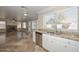 View from the kitchen, showing stainless steel appliances, granite countertops, and a fireplace at 7420 W Los Gatos Dr, Glendale, AZ 85310