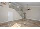 Bright living room with tile floors, high ceilings, a fan, and a staircase at 7420 W Los Gatos Dr, Glendale, AZ 85310