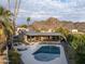 Expansive aerial view of a home showcasing its pool, outdoor living spaces, and scenic surroundings at 7508 N 21St St, Phoenix, AZ 85020