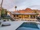 Stunning home with a refreshing pool, patio bar, and cozy fire pit, perfect for entertaining at 7508 N 21St St, Phoenix, AZ 85020