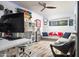 Versatile bonus room with comfortable seating, skateboard decor, and mini fridge for all your entertainment needs at 7508 N 21St St, Phoenix, AZ 85020