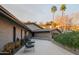 Exterior view of the driveway entrance, lush landscaping, and a modern-style home at 7508 N 21St St, Phoenix, AZ 85020