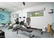 Bright home gym with a wall mirror, workout equipment, and a view of the outdoors for an invigorating workout at 7508 N 21St St, Phoenix, AZ 85020