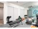 Bright home gym featuring modern workout equipment, large mirrors, and ample storage space at 7508 N 21St St, Phoenix, AZ 85020