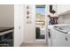 Well-organized laundry room with modern appliances and a view of the surrounding landscape at 7508 N 21St St, Phoenix, AZ 85020