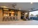 Spacious outdoor bar with a sleek countertop, seating, and open-air access to the living spaces at 7508 N 21St St, Phoenix, AZ 85020
