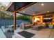 Stylish outdoor living space with comfortable seating, a fire pit, and lush landscaping at 7508 N 21St St, Phoenix, AZ 85020