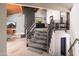 Modern staircase with metal railings that provides easy access to the other floors in this stylish home at 7508 N 21St St, Phoenix, AZ 85020