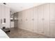 Spacious walk-in closet featuring custom built-in storage with drawers and ample hanging space for clothes and accessories at 7508 N 21St St, Phoenix, AZ 85020