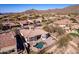 Expansive desert home with a private pool and patio area, set against a scenic mountain backdrop at 8041 E Teton Cir, Mesa, AZ 85207