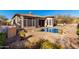Backyard and pool area showcasing desert landscaping at 8041 E Teton Cir, Mesa, AZ 85207
