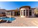 Pool with brick patio on the rear of the home at 8041 E Teton Cir, Mesa, AZ 85207