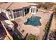 Aerial view of a backyard featuring a pool, spa, and lush landscaping, perfect for outdoor living at 8041 E Teton Cir, Mesa, AZ 85207