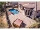 Aerial view of a backyard featuring a refreshing pool, spacious patio, hot tub and a well-maintained garden at 8041 E Teton Cir, Mesa, AZ 85207