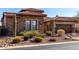 Inviting desert home with lush landscaping, a tile roof, and a convenient two-car garage at 8041 E Teton Cir, Mesa, AZ 85207