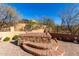 Inviting backyard hot tub with brick surround and steps, perfect for relaxation and enjoying the Arizona weather at 8041 E Teton Cir, Mesa, AZ 85207