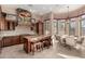 Gourmet kitchen featuring custom cabinets, granite countertops, stainless steel appliances, and breakfast nook perfect for dining at 8041 E Teton Cir, Mesa, AZ 85207