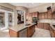 Well-appointed kitchen features a center island with a sink and overlooks the living area, perfect for entertaining at 8041 E Teton Cir, Mesa, AZ 85207