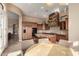 Spacious kitchen boasts custom cabinets, granite countertops, a center island, and an decorative range hood at 8041 E Teton Cir, Mesa, AZ 85207