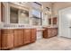 Upscale main bathroom featuring dual vanities, mirrors, and plenty of counter space and natural light at 8041 E Teton Cir, Mesa, AZ 85207