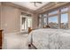 Serene main bedroom features a large bed, soft lighting, and a private entrance to the outdoor space at 8041 E Teton Cir, Mesa, AZ 85207