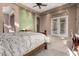 Lovely main bedroom with large windows, neutral colors, and access to a private outdoor area at 8041 E Teton Cir, Mesa, AZ 85207
