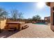 Backyard with a pool and hot tub surrounded by desert landscaping at 8041 E Teton Cir, Mesa, AZ 85207
