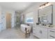 Bright bathroom featuring a soaking tub, walk-in shower, and vanity with marble countertops at 9318 E Cloudview Ave, Gold Canyon, AZ 85118