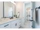 This bathroom showcases an elegant vanity with sleek fixtures and an open doorway to an adjacent bathroom at 9318 E Cloudview Ave, Gold Canyon, AZ 85118