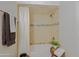 Detailed bathtub and shower area with decorative tile and coordinated towels at 9990 N Scottsdale Rd # 2020, Paradise Valley, AZ 85253