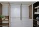 A closet featuring multiple dark wood shelves and hanging bars at 9990 N Scottsdale Rd # 2020, Paradise Valley, AZ 85253
