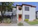 Condo building featuring stucco exterior, red tile roof, exterior staircase and mature landscaping at 9990 N Scottsdale Rd # 2020, Paradise Valley, AZ 85253